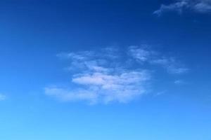 Stunning cirrus cloud formation panorama in a deep blue sky photo