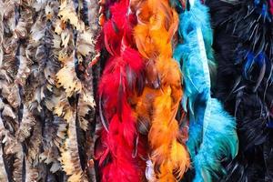 Detailed close up view on samples of cloth and fabrics in different colors found at a fabrics market photo
