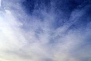 Stunning cirrus cloud formation panorama in a deep blue sky photo