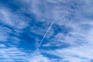 Stunning cirrus cloud formation panorama in a deep blue sky photo