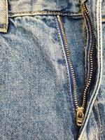 Zipper on jeans. Jeans texture. Unzipped jeans. photo