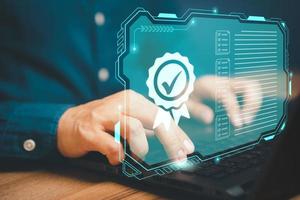Businessman working with sign of the top service quality assurance on virtual screen. Guarantee, Standards, ISO certification and standardization concept. photo