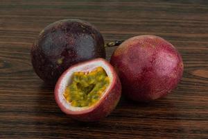 Passion fruit on wooden background photo