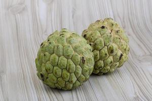 Custard apple on wooden background photo