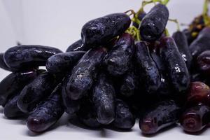 Witch grapes, moon drops, grapes or sweet sapphires picked from the garden fresh and new. It is a seedless grape that is sweet and delicious. photo