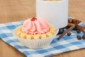 Creamy basket on wooden background photo