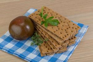 Crispbread on wooden background photo