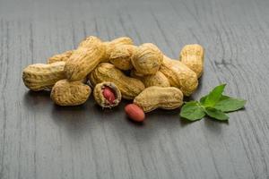 Peanut on wooden background photo