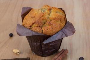 Muffin on wooden background photo