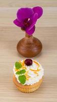 Cupcake on wooden background photo