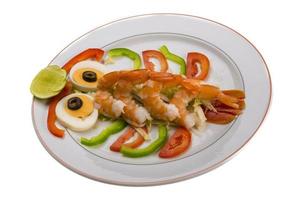 Shrimp cocktail on the plate and white background photo