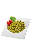 Marinated peas in a bowl on white background photo