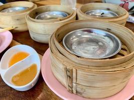 Dim sum top view and text input area, dim sum Chinese food in steamed bamboo is popular all over the world. photo