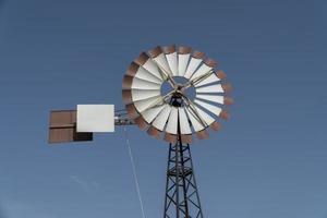 blue sky and wind turbine photo