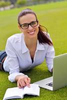 woman with laptop in park photo