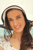 portrait of happy young woman on beach photo