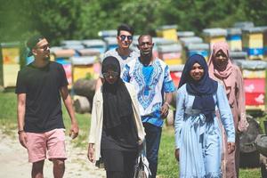 people group visiting local honey production farm photo