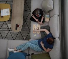 mother and daughter at home playing memory game photo