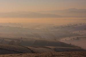 winter landscape with fog and pollution photo