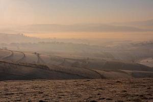 winter landscape with fog and pollution photo