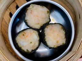 Dim sum top view and text input area, dim sum Chinese food in steamed bamboo is popular all over the world. photo