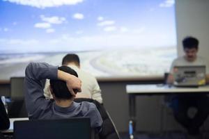 young man dreaming clouds on presentation photo