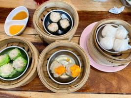 Dim sum top view and text input area, dim sum Chinese food in steamed bamboo is popular all over the world. photo