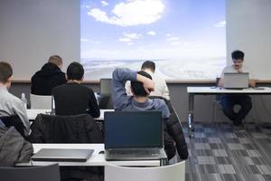 young man dreaming clouds on presentation photo