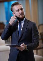 business man wearing protective face mask at office photo