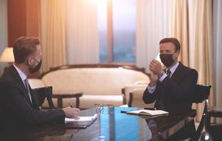 business people wearing crona virus protection face mask on meeting photo