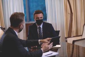 business people wearing crona virus protection face mask on meeting photo