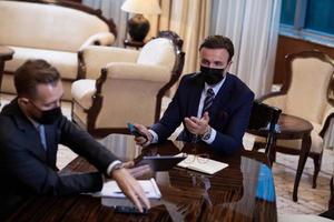 business people wearing crona virus protection face mask on meeting photo