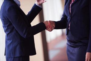 business womans make deal and handshake photo