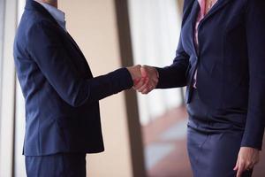 business womans make deal and handshake photo