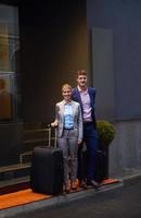 business people couple entering  hotel photo