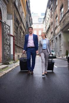 business people couple entering  hotel photo