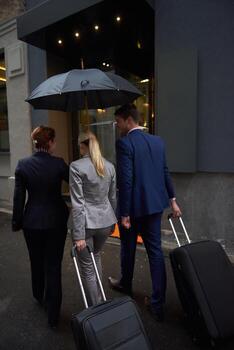 business people couple entering  hotel photo