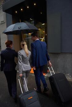 business people couple entering  hotel photo