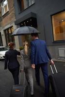 business people couple entering  hotel photo