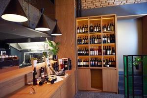 Wine bottles on a wooden shelf. photo