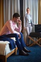 young couple in modern hotel room photo