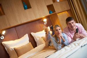 young couple in modern hotel room photo