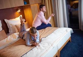 young couple in modern hotel room photo