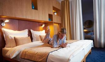 young business woman relaxing in hotel room photo