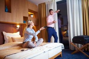 young couple in modern hotel room photo