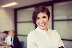 hispanic businesswoman with tablet at meeting room photo