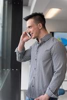 young business man speaking on  smart phone at office photo