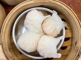 Dim sum top view and text input area, dim sum Chinese food in steamed bamboo is popular all over the world. photo