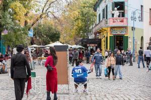 BUENOS AIRES, ARGENTINA - MAY, 9 2015 - Maradona lookalike at la boca painted house in Buenos Aires photo