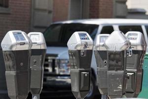 parking meters together photo